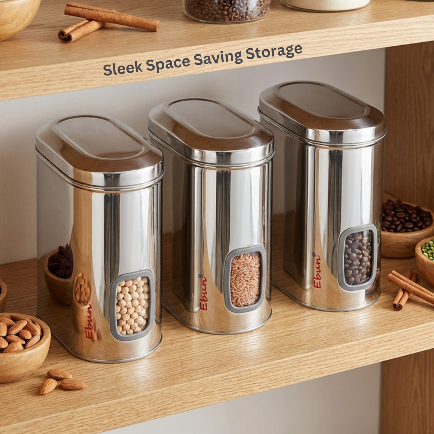 Three stainless steel storage containers on a wooden shelf with visible brand name 'Ebun'.